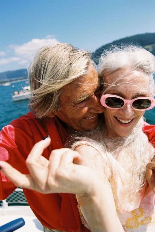 A smiling older couple hugging on holiday